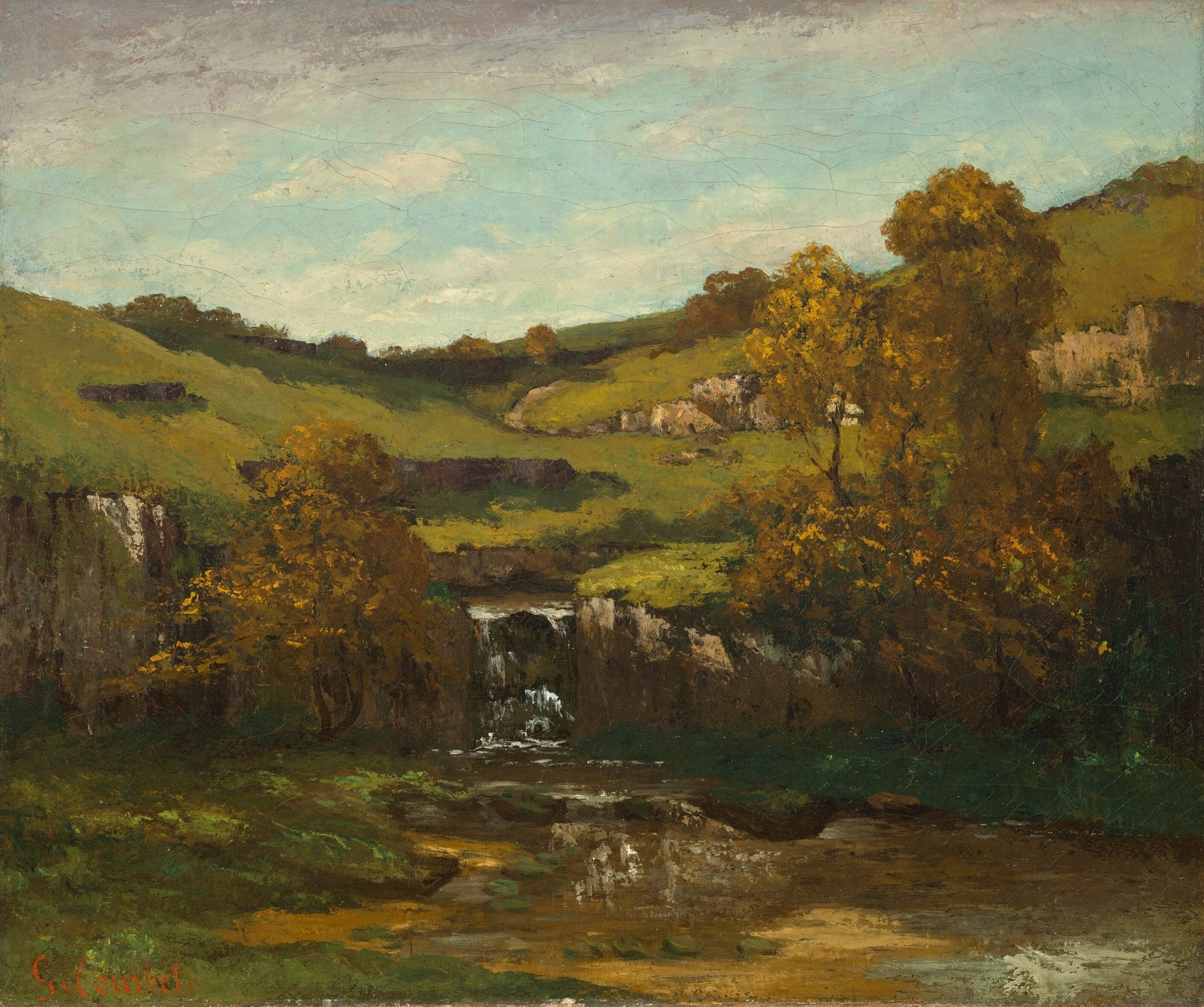 An oil landscape painting depicting a scenic valley with a small waterfall, trees with golden-yellow foliage, green hills, and a cloudy blue sky.
