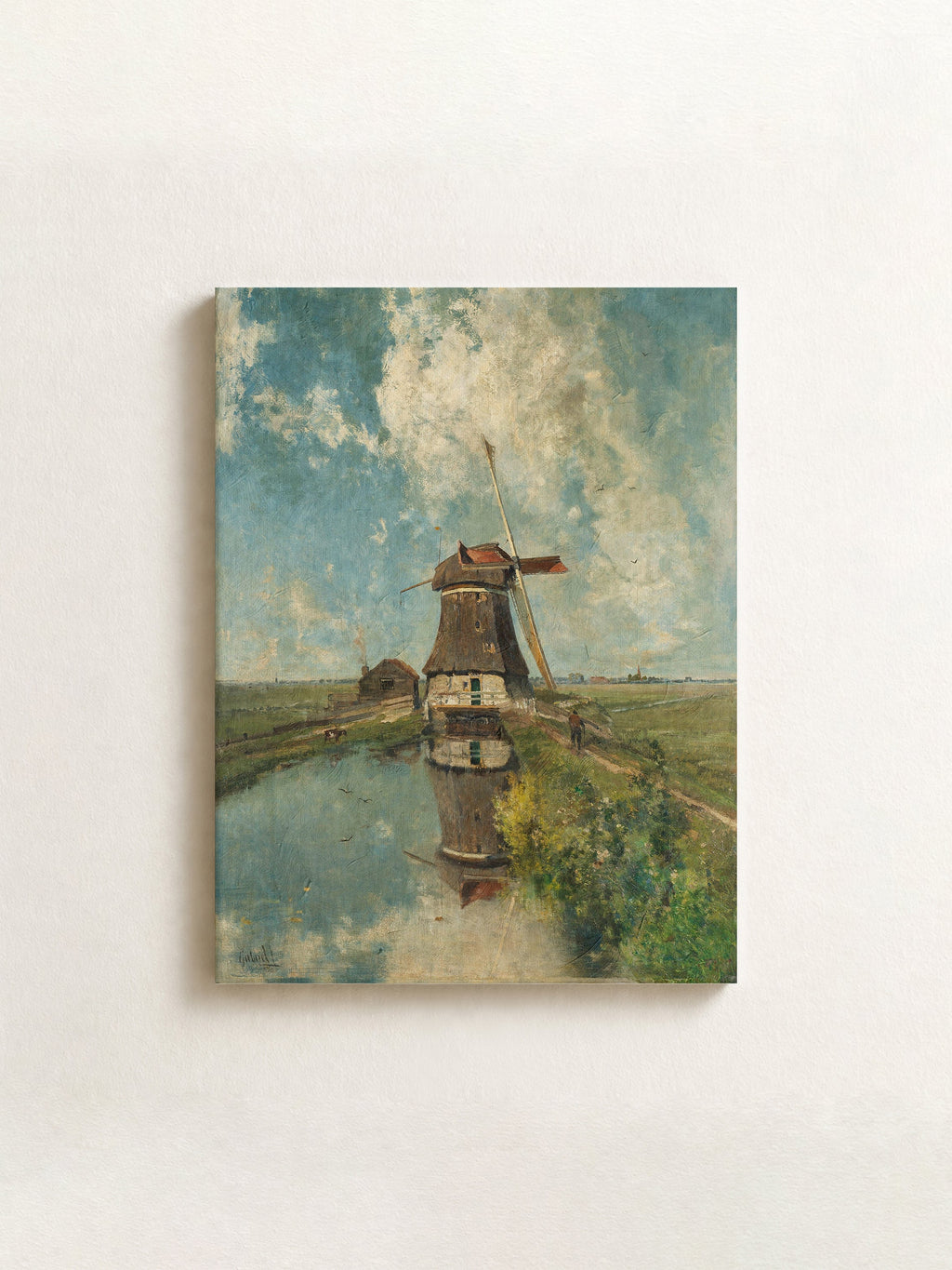 A horizontal canvas wall art print depicting an impressionistic landscape with a windmill, shown hanging on a textured off-white wall.