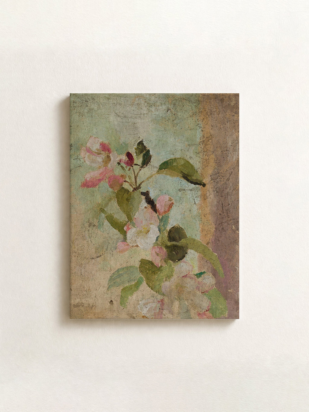 A rectangular canvas wall art print featuring a vintage-style painting of pink blossoms and green leaves on a textured beige and muted blue background, displayed against a light off-white wall.