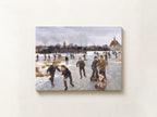 A square canvas print of a classic painting depicting children ice skating on a snowy field, mounted on a textured off-white wall.