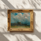 An ornate gold-framed landscape painting hanging on a textured white wall, with dappled sunlight and shadows cast across the frame and wall.