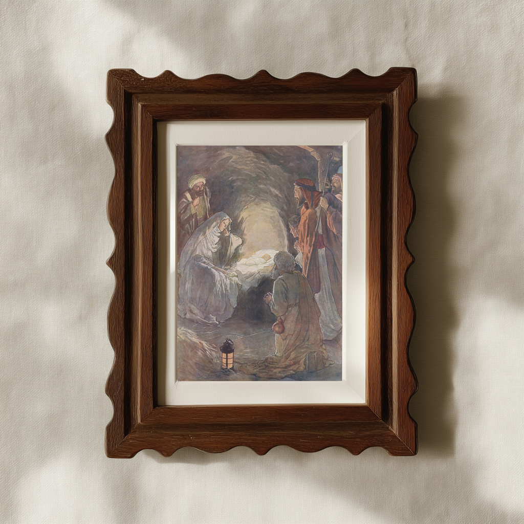 A framed art print depicting a classical religious scene with figures around a glowing body, mounted on a textured beige wall with soft shadows.