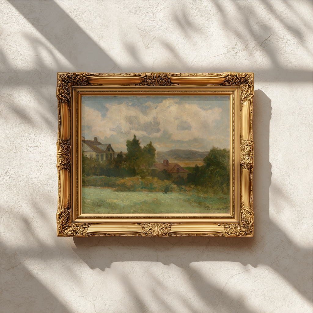 An ornate gold picture frame holding a landscape painting, mounted on a textured white wall with soft window shadow patterns.