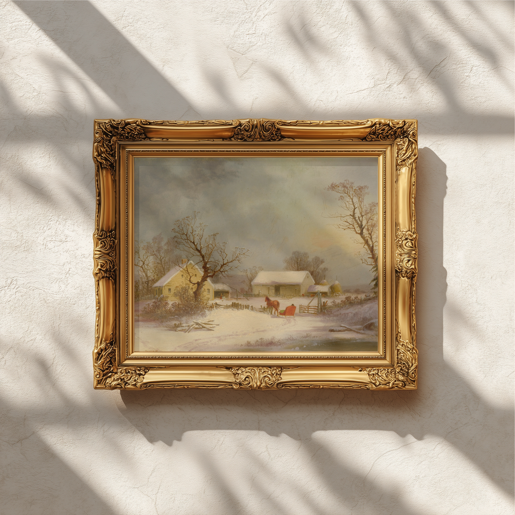 An ornate gold picture frame containing a winter landscape painting, mounted on a textured white wall with soft window shadow patterns.