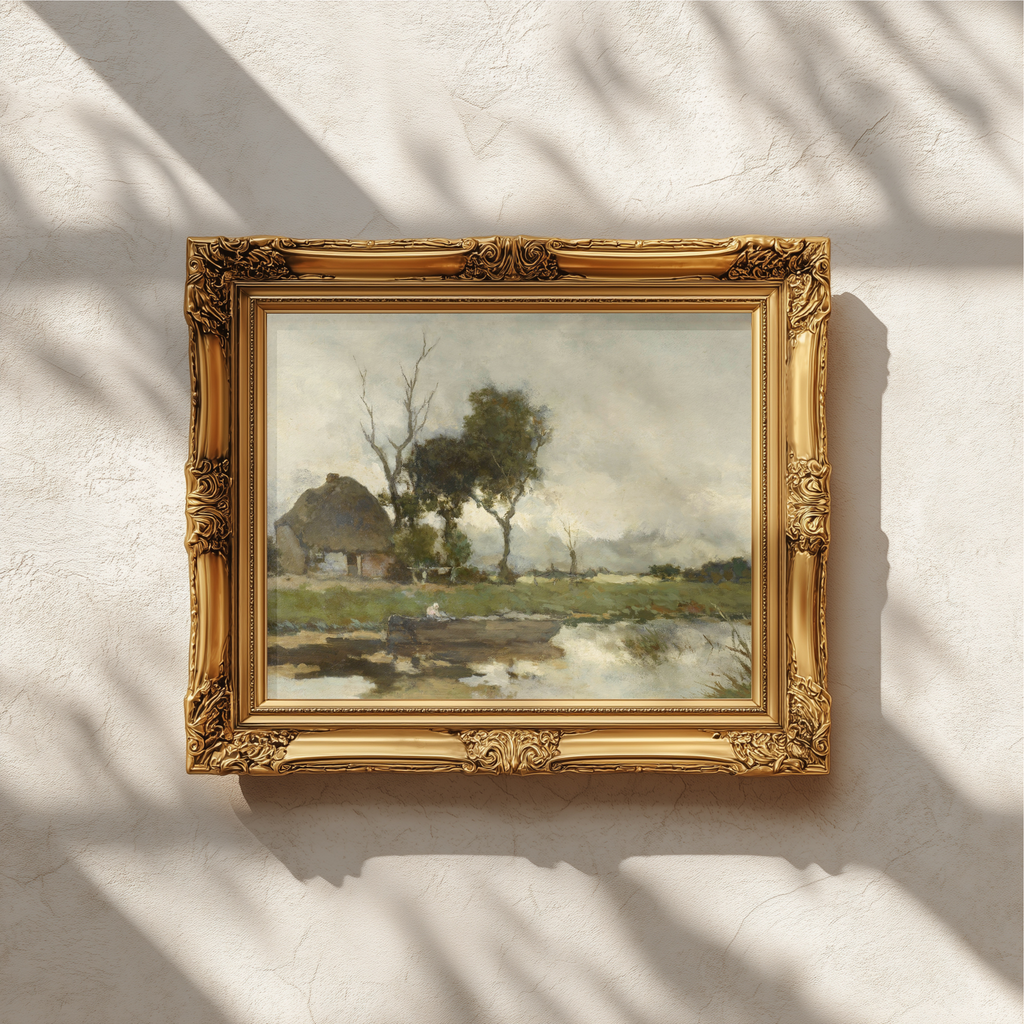 An ornate gold picture frame holding a landscape painting, mounted on a textured white wall with soft window shadow patterns.