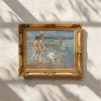 An ornate gold-framed painting hanging on a textured white wall, with soft window shadows cast across the scene. The painting depicts children playing outdoors in soft blue, beige, and pink tones.