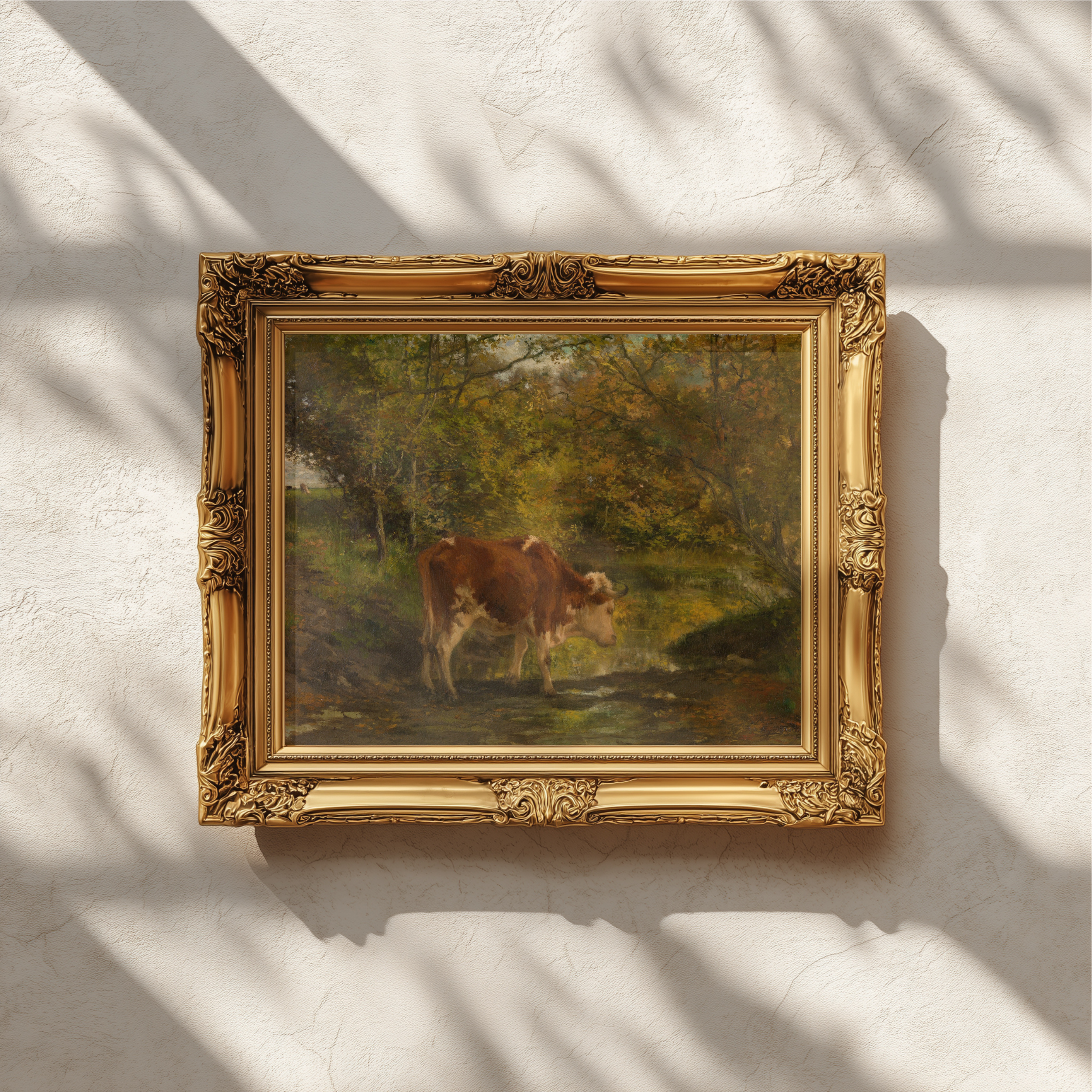 An ornate gold-framed painting of a horse in a green landscape, mounted on a textured white wall with soft window shadow patterns.