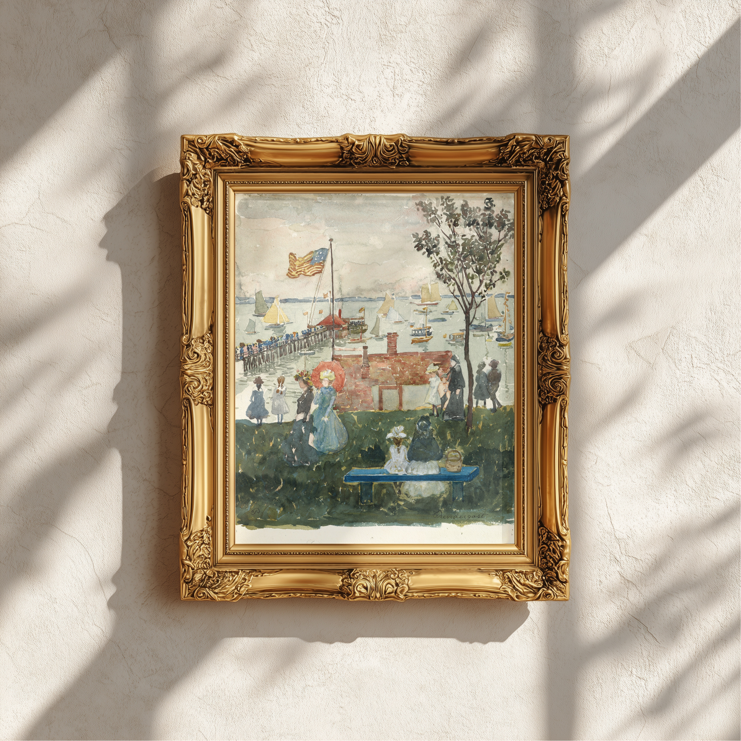 A framed impressionist landscape painting hangs on a textured off-white wall, casting soft shadows from nearby foliage. The painting depicts a harbor scene with boats, figures, and a tree, enclosed in an ornate gold frame.