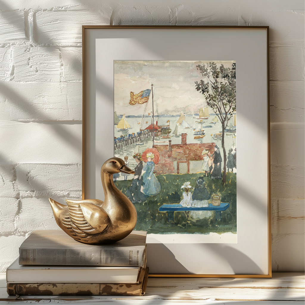 A framed art print featuring a vintage watercolor painting of a harbor scene with people, boats, and a red-roofed building, styled on a white brick wall next to a gold duck figurine and books.