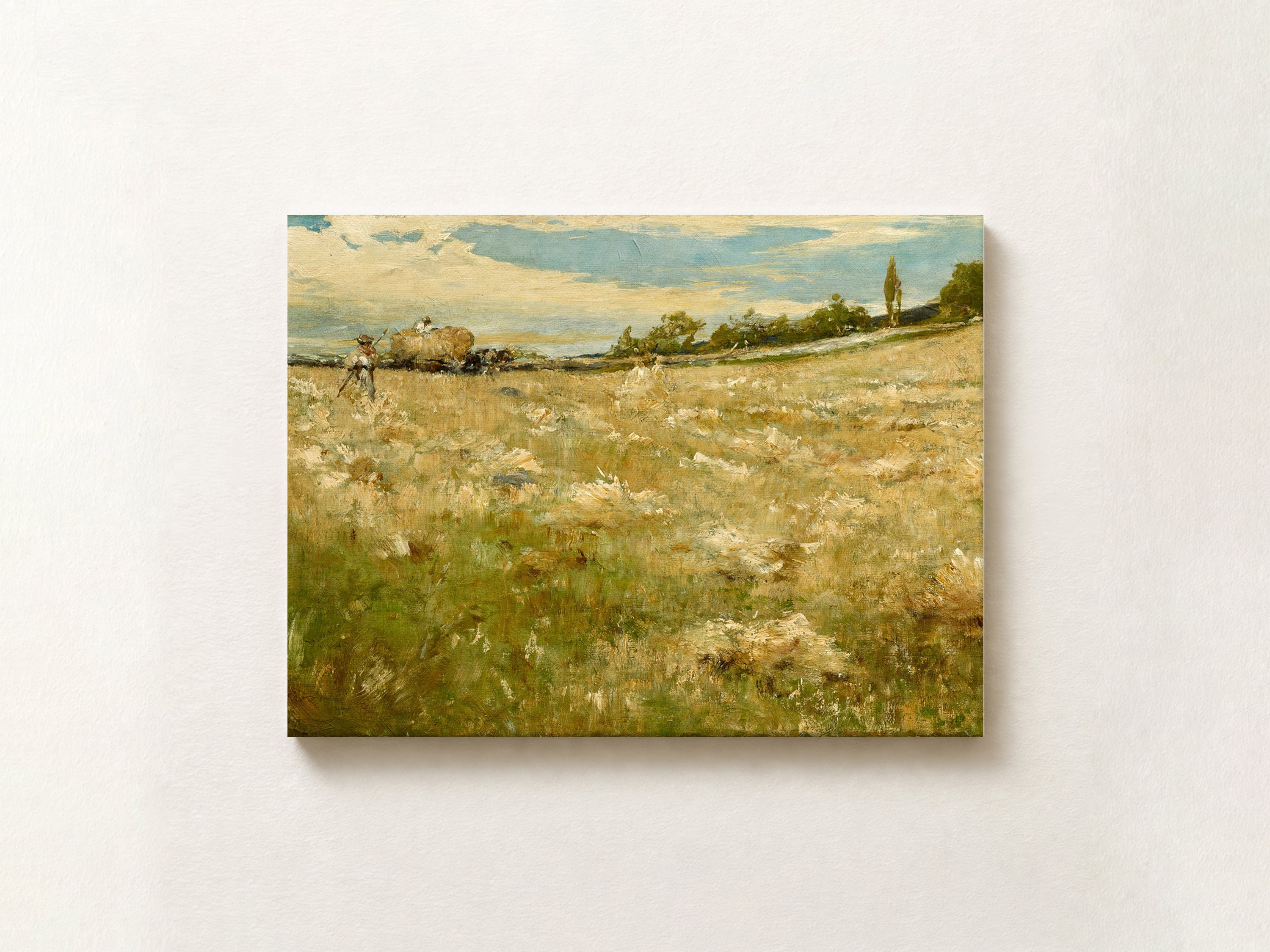 A horizontal canvas painting of a rural landscape, featuring a golden field under a cloudy blue sky, mounted on a light beige wall.